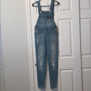 Ripped denim overalls